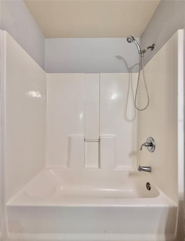 full bath featuring shower / bathtub combination