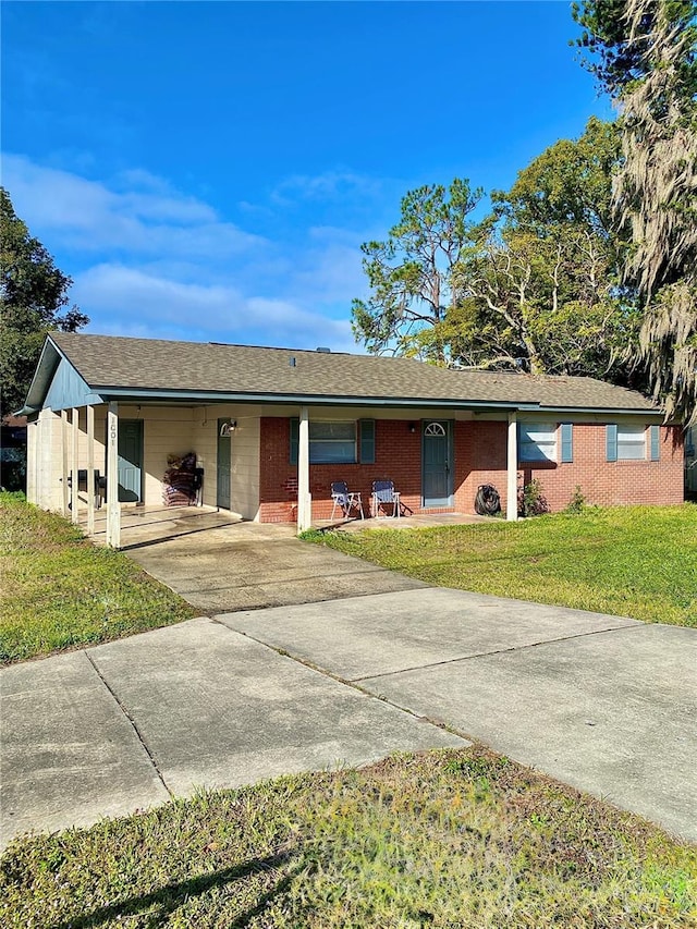 ranch-style house with a front lawn and a carport