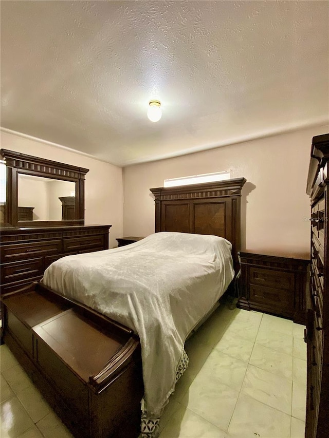 bedroom with a textured ceiling