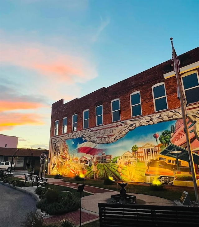 view of outdoor building at dusk