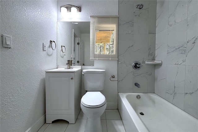 full bathroom featuring tile patterned flooring, vanity, toilet, and tiled shower / bath