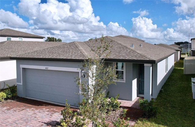 ranch-style home featuring a garage