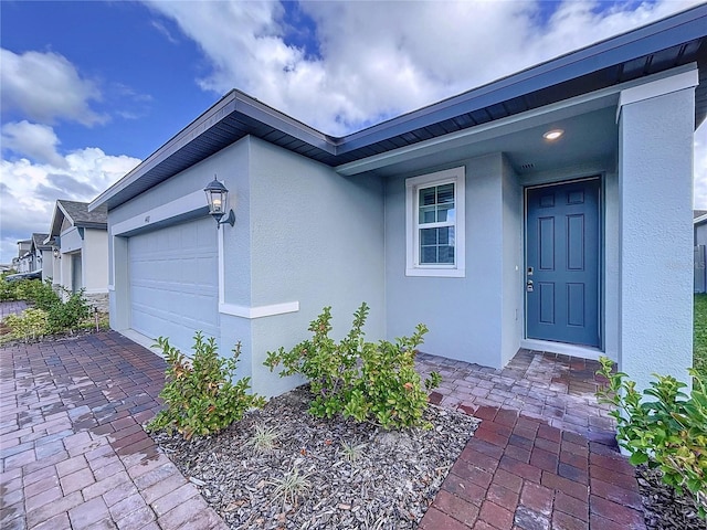 doorway to property featuring a garage