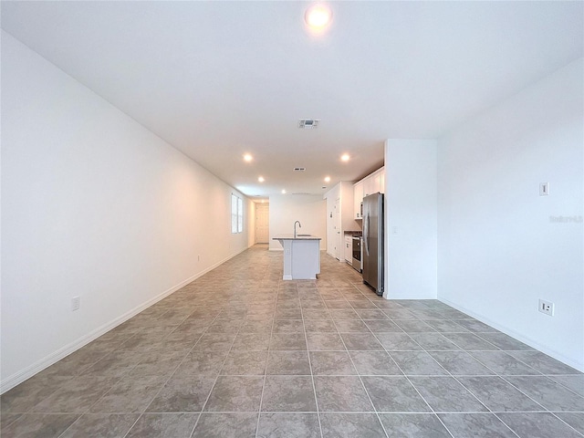 interior space featuring sink and light tile patterned floors