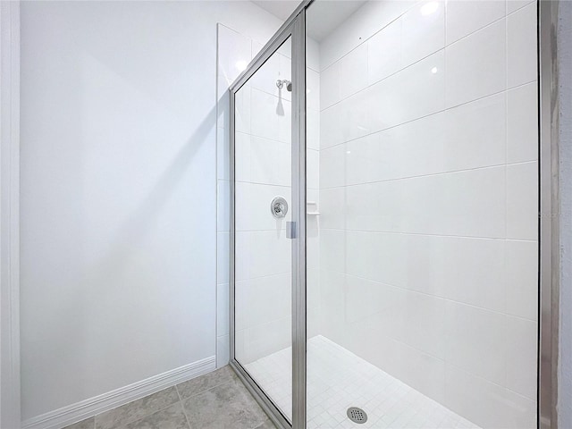 bathroom featuring tile patterned floors and an enclosed shower