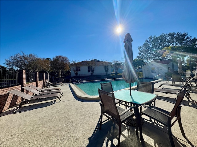 view of swimming pool with a patio