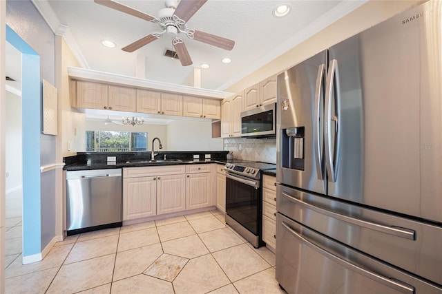 kitchen with appliances with stainless steel finishes, sink, backsplash, light tile patterned floors, and crown molding