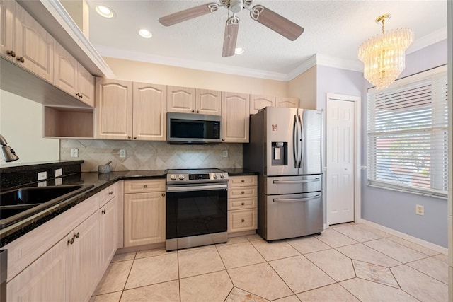 kitchen with appliances with stainless steel finishes, decorative light fixtures, sink, decorative backsplash, and crown molding