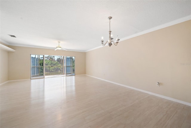 empty room featuring ceiling fan with notable chandelier, light hardwood / wood-style flooring, ornamental molding, and a textured ceiling