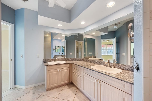 bathroom featuring ceiling fan, vanity, and tile patterned flooring