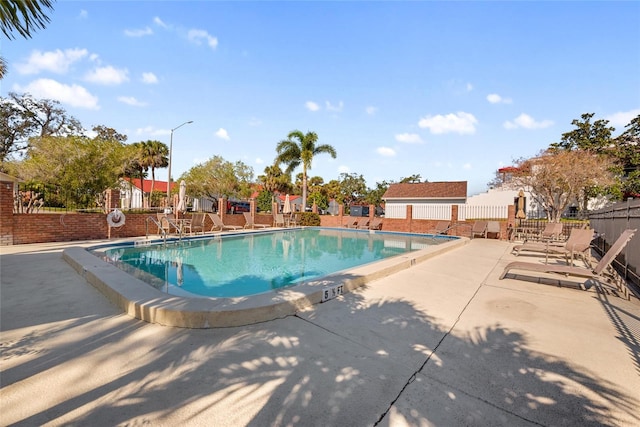 view of swimming pool with a patio area