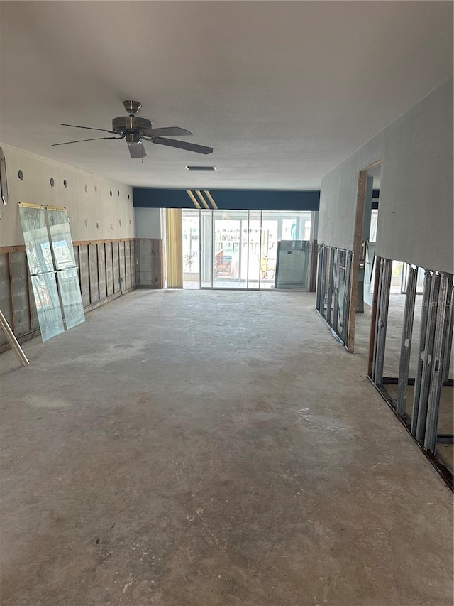 spare room with concrete flooring and ceiling fan