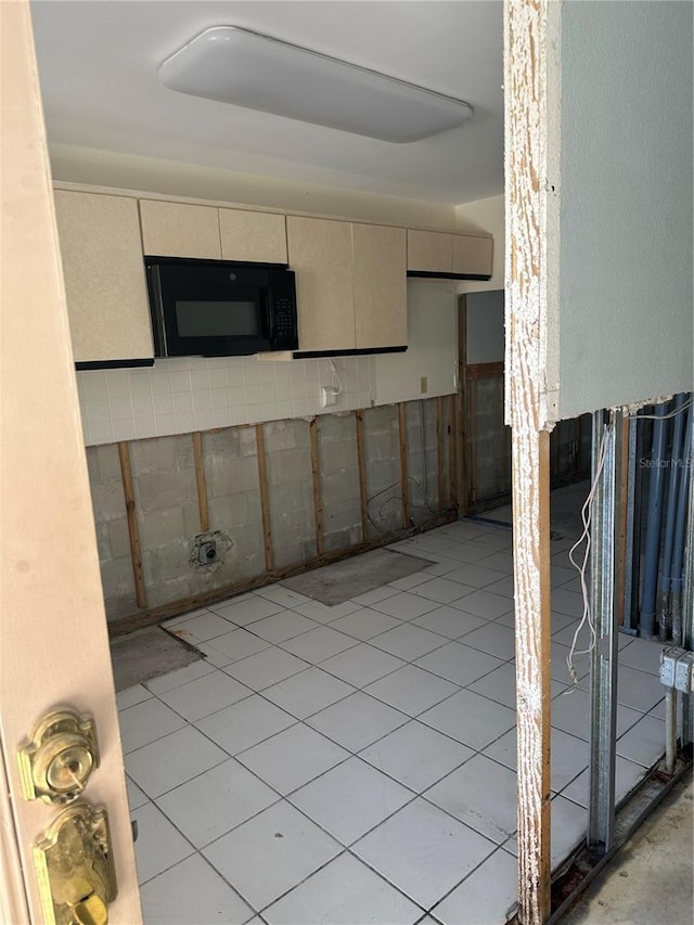 interior space with cream cabinets