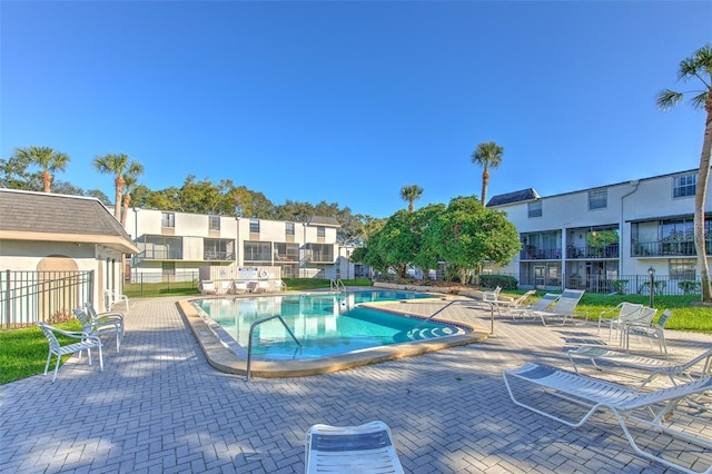 view of swimming pool featuring a patio area