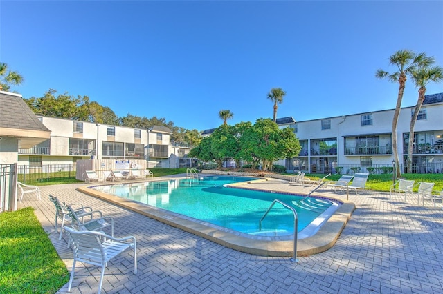 view of swimming pool featuring a patio area