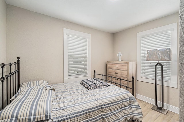 bedroom with light hardwood / wood-style floors