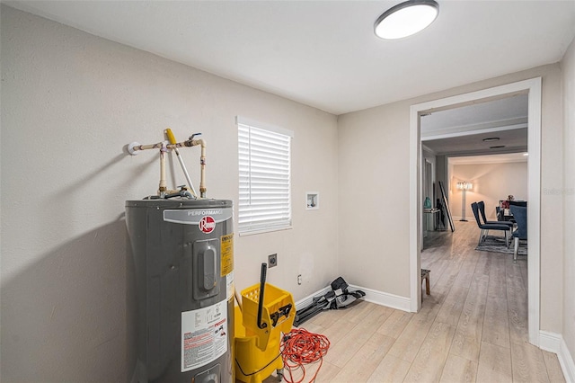 utility room featuring water heater