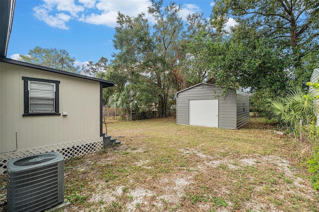 view of yard featuring cooling unit and a shed