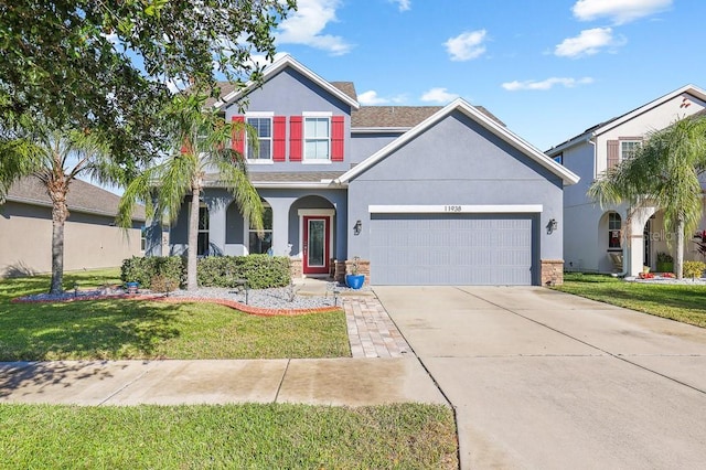 view of front facade with a front lawn and a garage