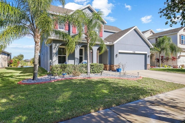 view of front of property with a garage and a front lawn