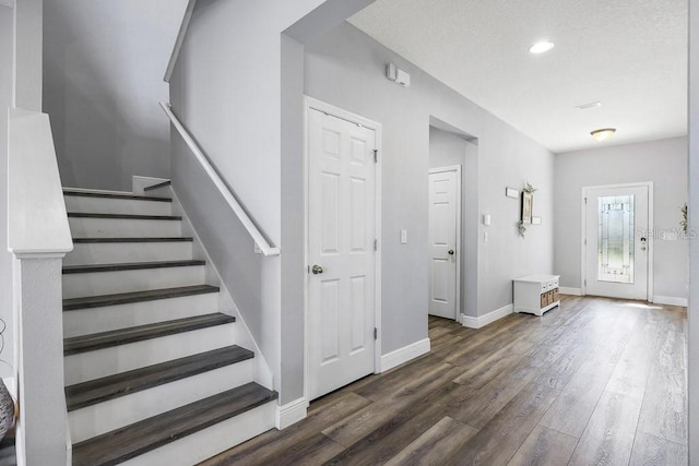 foyer featuring dark hardwood / wood-style floors