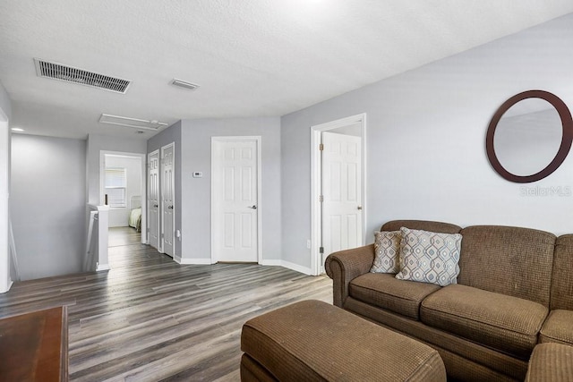 living room with dark hardwood / wood-style flooring