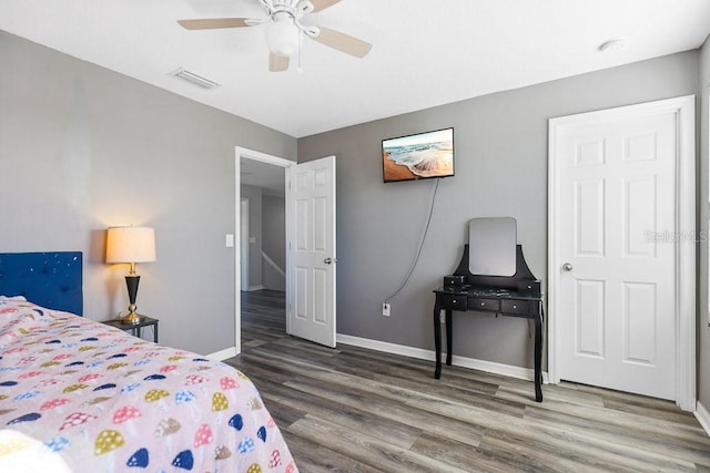 bedroom featuring hardwood / wood-style flooring and ceiling fan