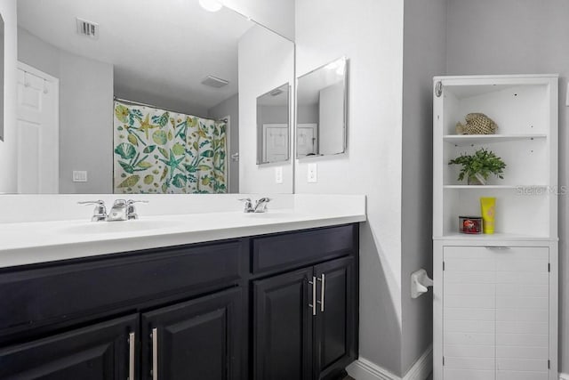 bathroom featuring vanity and a shower with shower curtain