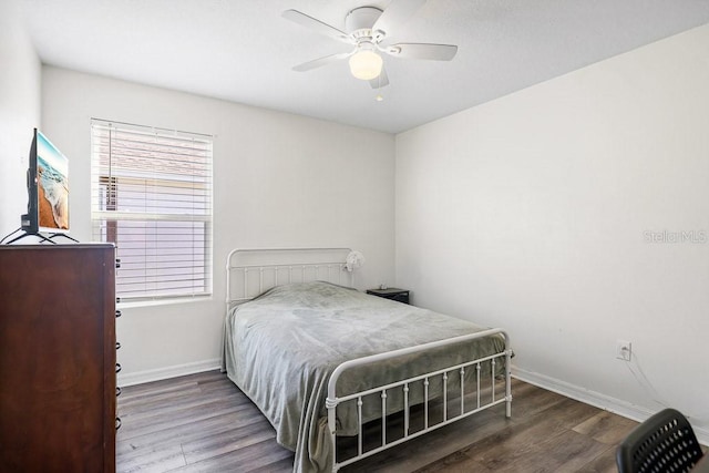 bedroom featuring ceiling fan and dark wood-type flooring