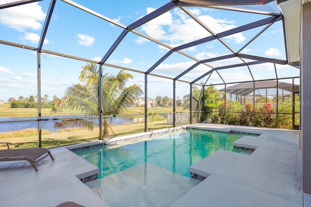 view of swimming pool with a water view and a lanai