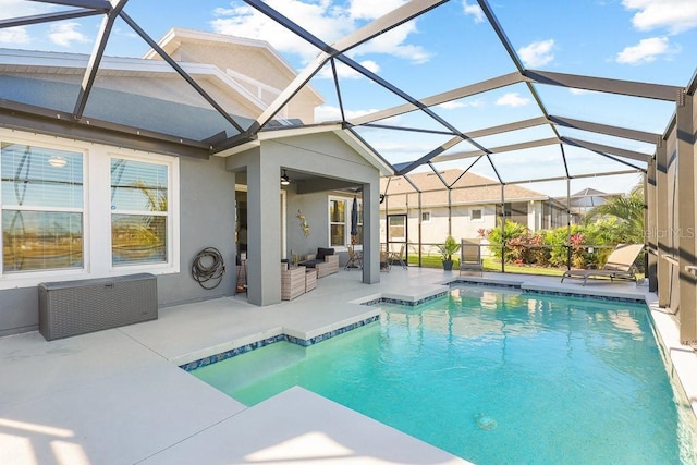 view of swimming pool with a lanai and a patio