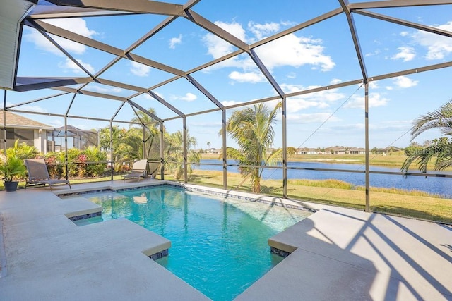 view of swimming pool featuring glass enclosure, a patio area, and a water view