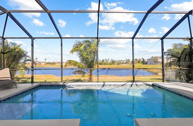 view of pool featuring a lanai and a water view