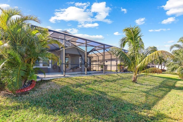 view of yard with a lanai and a patio