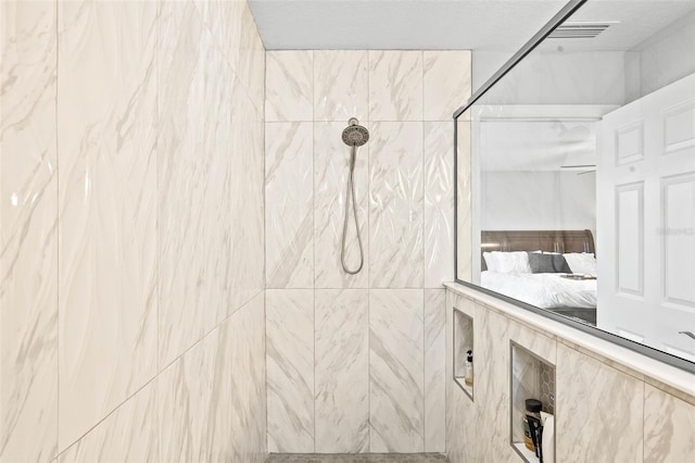 bathroom featuring tiled shower