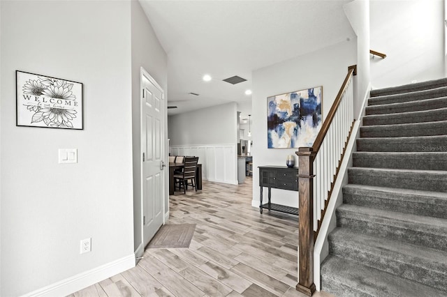 stairway featuring hardwood / wood-style floors