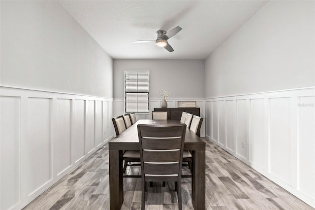 dining area featuring ceiling fan and light hardwood / wood-style flooring