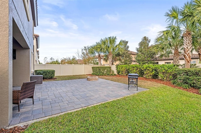 view of patio / terrace featuring an outdoor fire pit