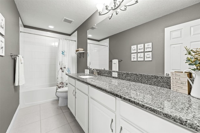 bathroom with vanity, visible vents, tile patterned flooring, a textured ceiling, and toilet