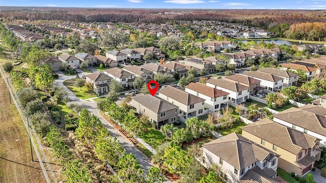 bird's eye view featuring a residential view and a water view