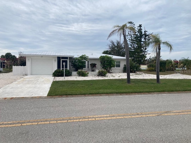 ranch-style home with a garage and a front lawn