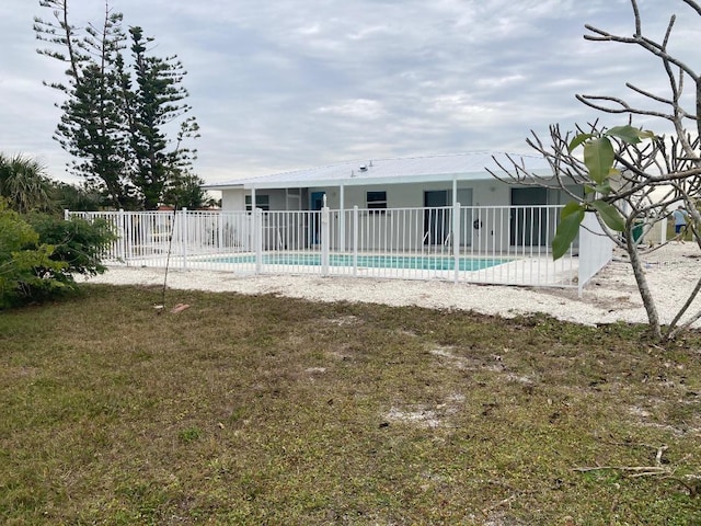 view of swimming pool featuring a yard and a patio