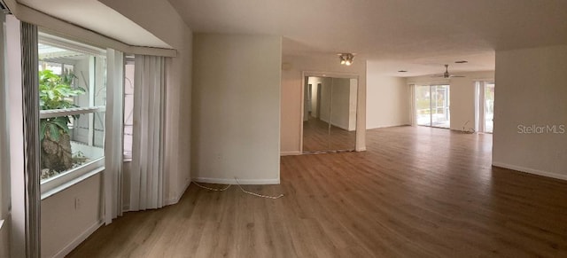 spare room featuring hardwood / wood-style flooring and ceiling fan