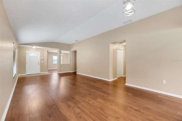 interior space with lofted ceiling and hardwood / wood-style flooring