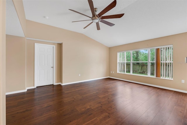 spare room with dark wood-type flooring, ceiling fan, and lofted ceiling