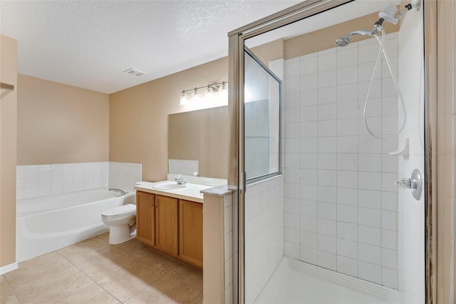 full bathroom featuring vanity, plus walk in shower, tile patterned flooring, toilet, and a textured ceiling