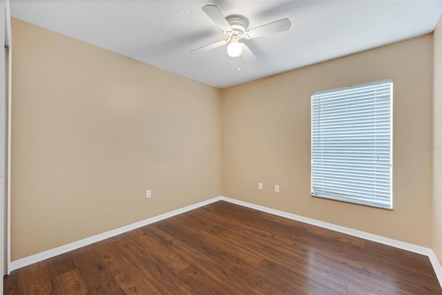 empty room featuring ceiling fan and wood-type flooring