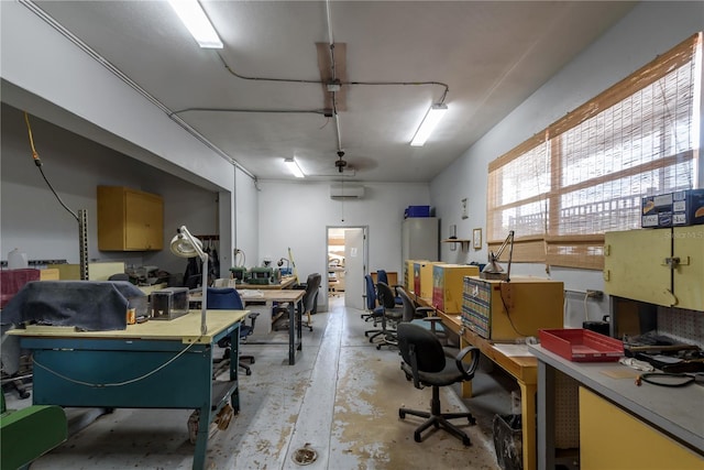 garage featuring a wall mounted air conditioner and a workshop area