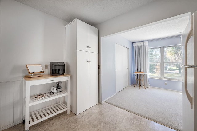 2386 Sumatran Way Unit 34, Clearwater, FL 33763 - office with a textured ceiling and light carpet