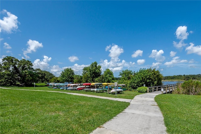 view of home's community featuring a lawn